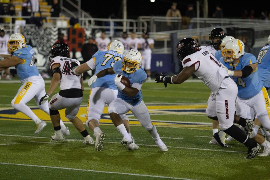 Marquez Cooper runs it down field during Kent State's 52-47 win over Northern Illinois on Wednesday night. 