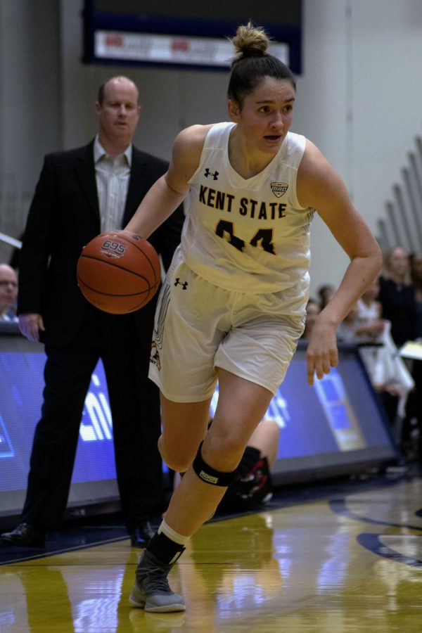 Sophomore forward Lindsey Thall (44) dribbles the ball down the court during the women's basketball game on Jan. 29, 2020. Kent State won against Ball State University 69-68.