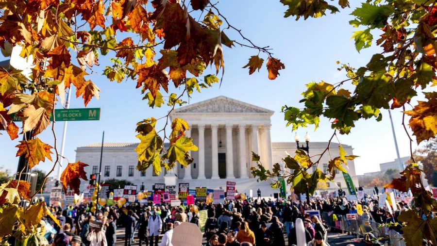 Abortion rights advocates and anti-abortion protesters demonstrate in front of the U.S. Supreme Court, Wednesday, Dec. 1, 2021, in Washington, as the court hears arguments in a case from Mississippi, where a 2018 law would ban abortions after 15 weeks of pregnancy, well before viability. 