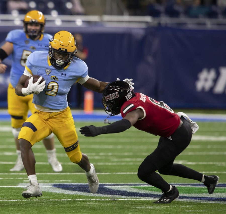 Graduate student running back Xavier Williams (2) runs the ball during the MAC Championship against Northern Illinois University in Detroit, Michigan on Dec. 04, 2021. Kent State lost to NIU 41-23.