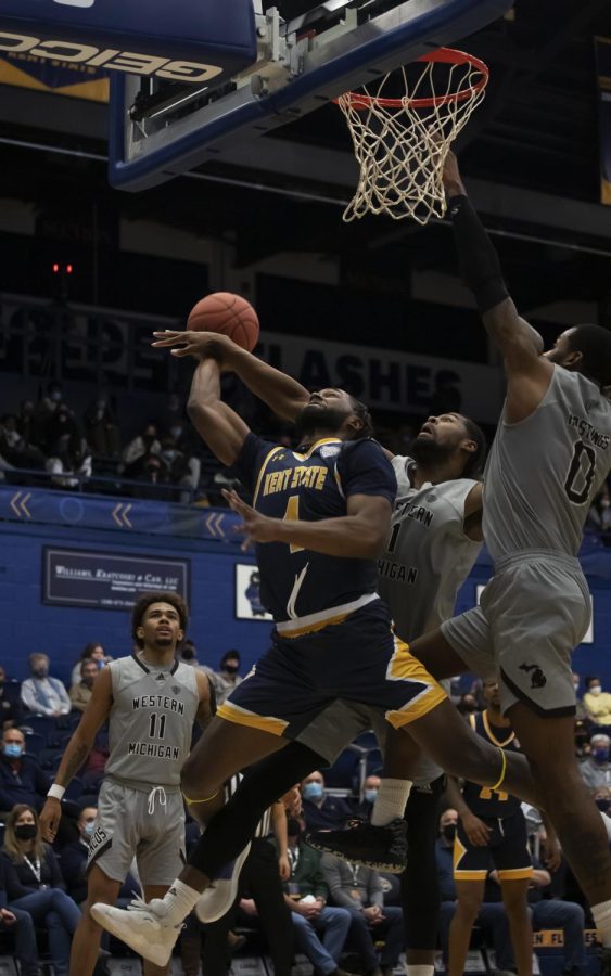 Graduate student Andrew Garcia (4) goes in for a layup during the men's basketball game on Jan. 25, 2022 against Western Michigan University. Kent State beat Western Michigan 75-64.