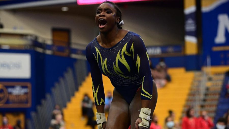 Sophomore gymnast Kyndall Gilbert reacts during the Kent State gymnastic team's opening meet against Northern Illinois and Southeast Missouri State on Sunday, January 16. 