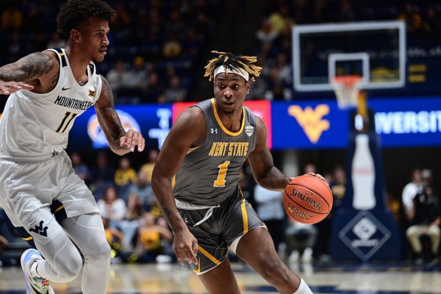 Redshirt freshman VonCameron Davis dribbles the ball during the Kent State men's basketball loss to West Virginia in Morgantown, West Virginia on Sunday, Dec. 12.