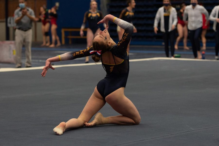 Cheyenne Pretola ends her floor routine with flourish during the gymnastics meet against Rutgers and Cornell University on Jan. 28, 2022.