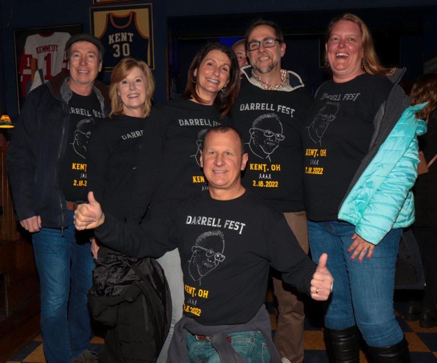 A group of friends celebrate their own festival, "The Darrell Fest", when their friend Darrell is visiting from North Carolina at the BeatleFest music festival in downtown Kent on Friday, Feb. 18. They keep this tradition each time Darrell visits, and this year it aligned with the Beatle Fest.