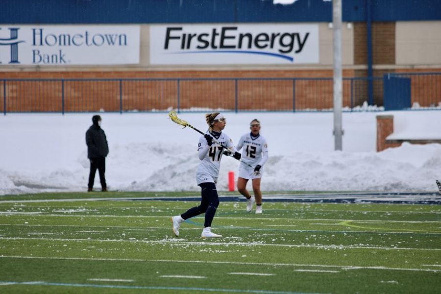 Junior midfielder Allison Kortowich makes a move during the Kent State lacrosse team's loss to Duquesne in Kent, Ohio on Sunday, Feb. 20.