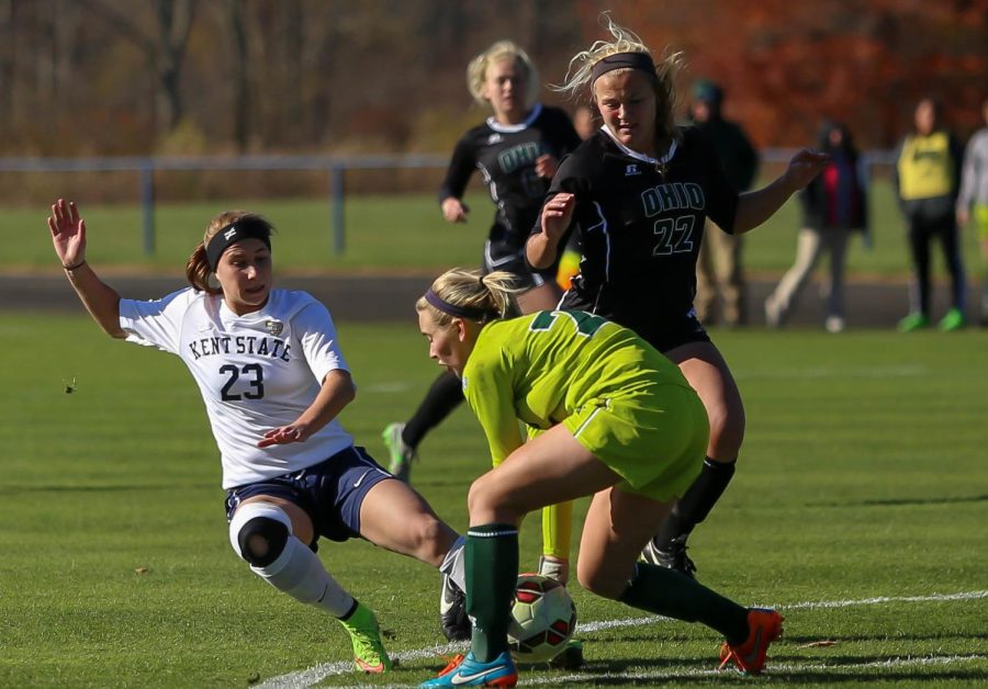 Junior forward, Jenna Hellstrom, dives for the ball in front OU’s goalie at Zoeller Field on Thursday Oct. 29, 2015. The Flashes won 1-0.