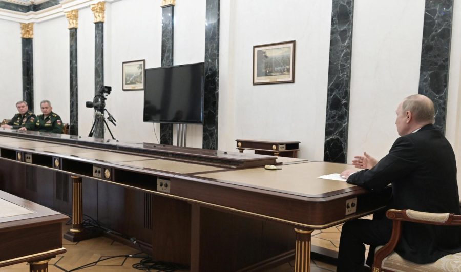 Russian President Vladimir Putin, right, speaks to Russian Defense Minister Sergei Shoigu, second left, and Head of the General Staff of the Armed Forces of Russia and First Deputy Defense Minister Valery Gerasimov, left, during their meeting in Moscow, Russia, Sunday, Feb. 27, 2022. Putin has ordered Russian nuclear forces on high alert amid tensions with the West over his invasion of Ukraine. (Alexei Nikolsky, Sputnik, Kremlin Pool Photo via AP)