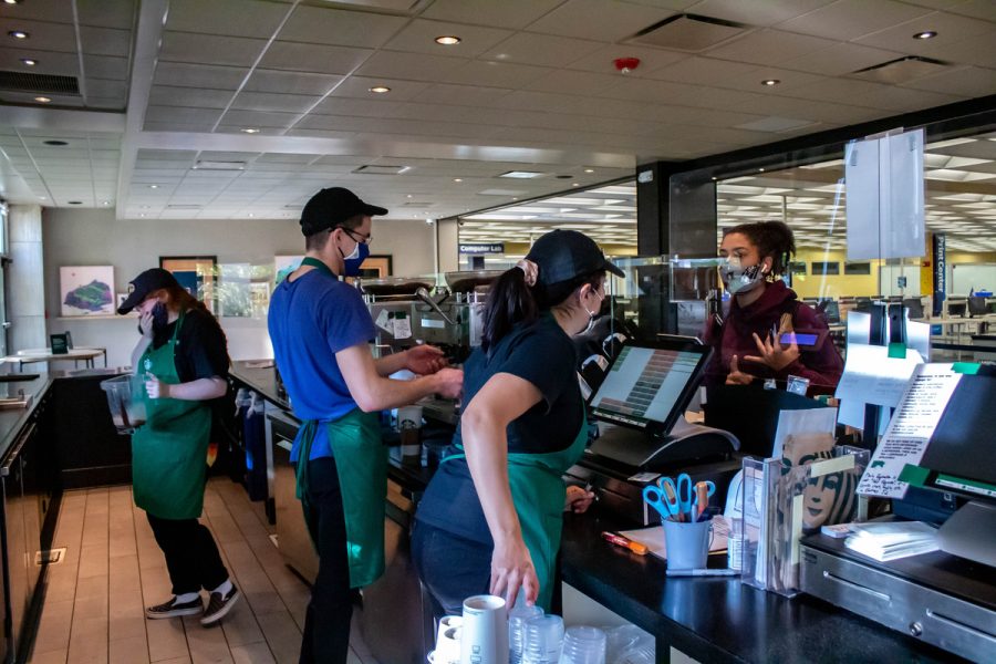 Student workers work at the Starbucks located in Kent State University's Library. Feb. 26, 2022.