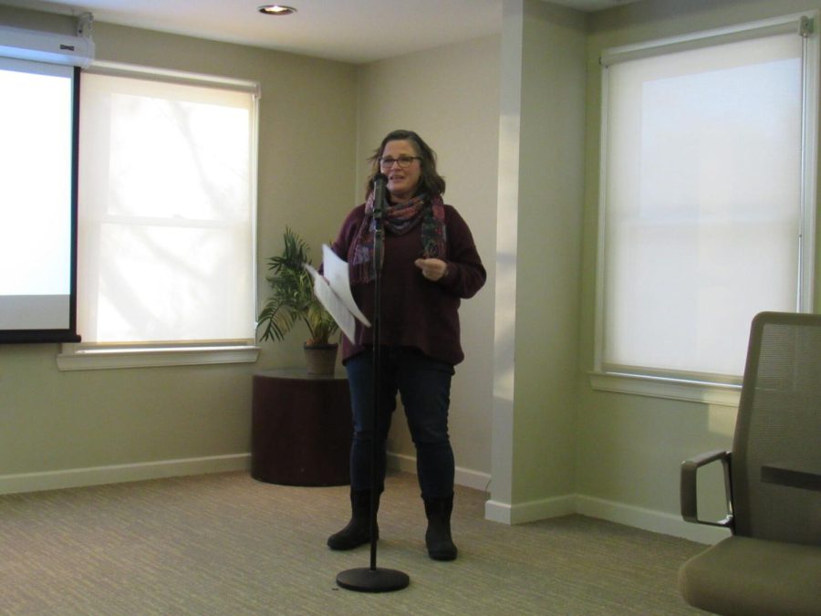 Cassandra Pegg-Kirby, director of the Women's Center, speaks at the "Speaker on the Path: The Words and the Works of Bell Hooks" event at the Williamson house on Tuesday, Jan. 25, 2022.