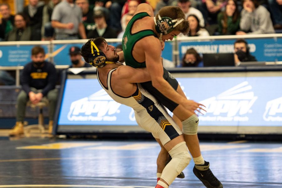 Fifth year Jake Ferri lifts his Ohio University opponent off his feet during the grudge match on Feb. 4, 2022.