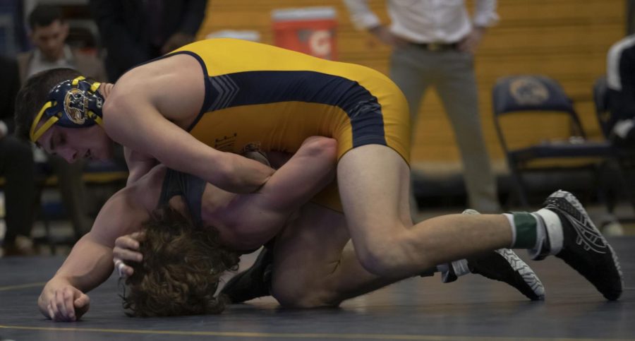 Senior Colin McCracken attempts to pin a Cleveland State University wrestler during the meet on Jan. 27, 2022 in Kent, OH. Kent State beat Cleveland State 27-9.