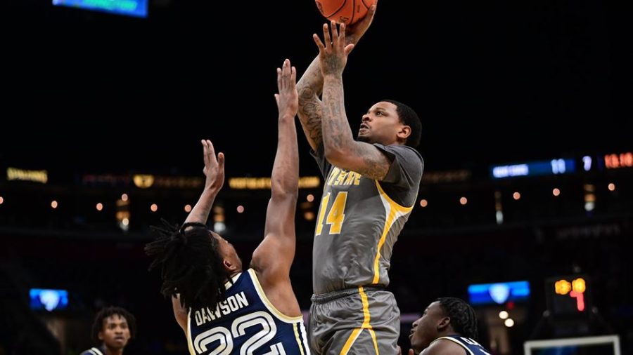 Redshirt senior forward Tervell Beck goes up for a shot during the Kent State men's basketball team's loss to Akron in the MAC Championship on Saturday, March 12 in Cleveland, Ohio.