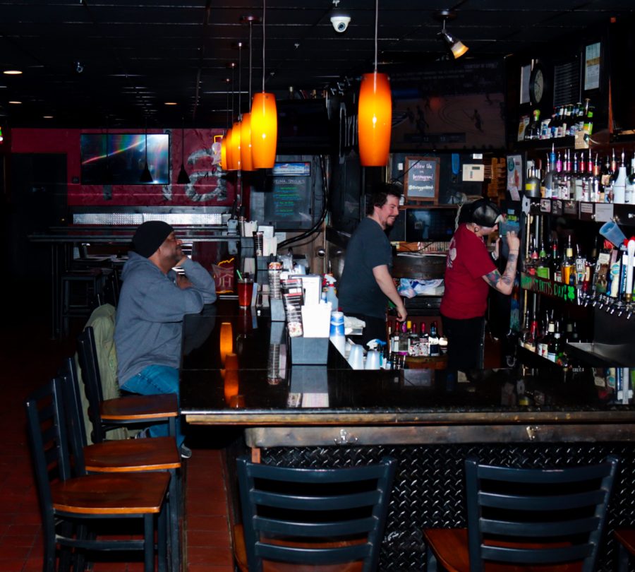 A customer sits at the bar of Euro Gyro, a bar and restaurant in downtown Kent.