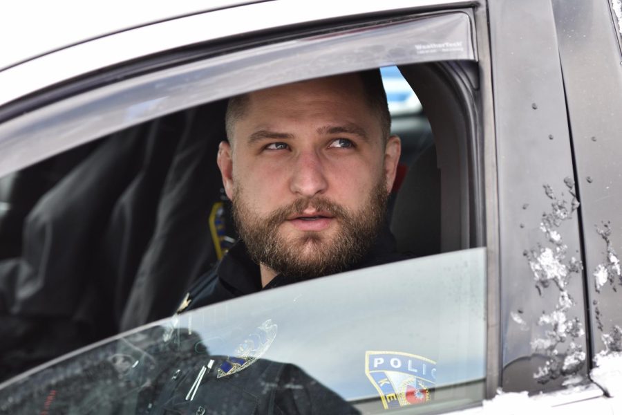 Officer Trevor White patrols the streets in the early morning on Fake Paddy's Day March 12, 2022.