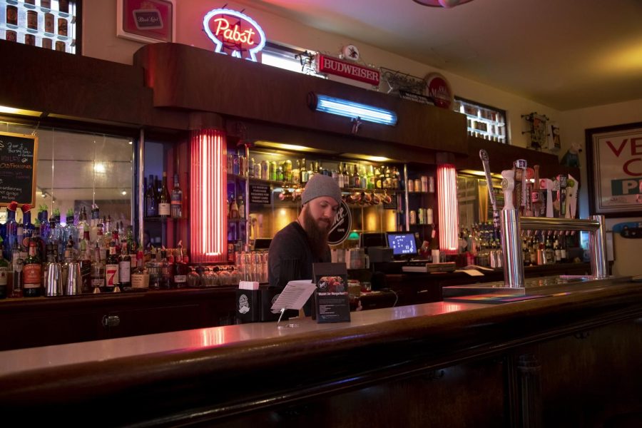 Bartender Scotty works on making a drink during his shift at Venice Café. Venice Café shares space with Erie Street Kitchen and is located at 163 W Erie St in Kent, Ohio. 