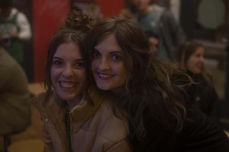 Kent State University senior Hannah Bower (left) and Stephanie Swain (right) wait for their food with friends at DP Dough on March 13, 2022. Bower and Swain spent their Fake Paddy's Day night at the bars in downtown Kent. 