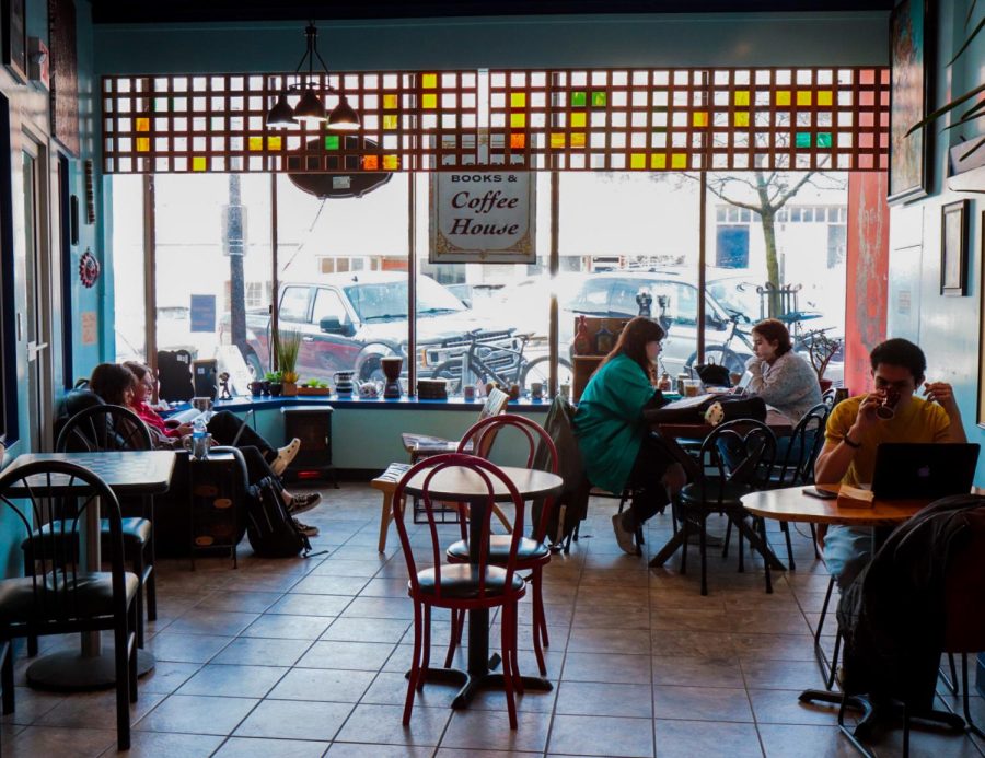 Students sit and do homework and drink coffee at Last Exit books in downtown Kent.