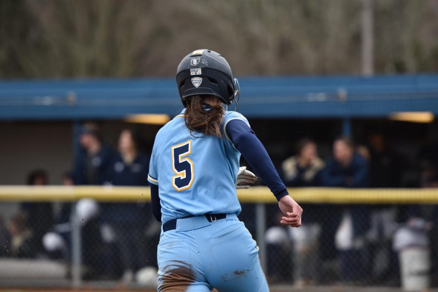 Kent State graduate student Madyson Cole breaks for home base.