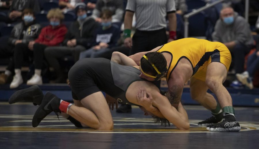 Redshirt junior Brendon Fenton wrestles a Cleveland State University wrestler during the meet on Jan. 27, 2022 in Kent, OH. Kent State beat Cleveland State 25-7.