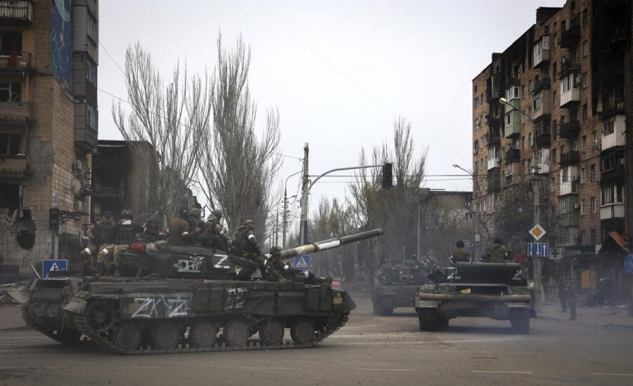 Russian military vehicles move in an area controlled by Russian-backed separatist forces in Mariupol, Ukraine, Saturday, April 23, 2022. (AP Photo/Alexei Alexandrov)