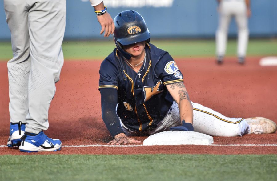 Kent State sophomore Kyle Jackson slides to third base.