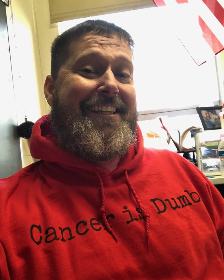 Garrison Wollam wears a "Cancer is Dumb" sweatshirt from his campaign.