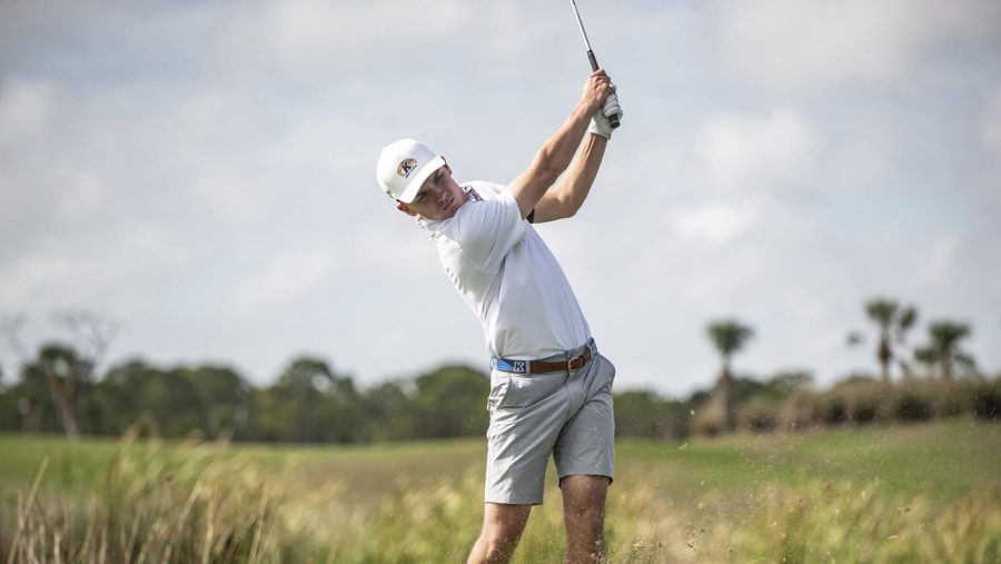 Freshman golfer Jordan Gilkison hits a shot during a Kent State men's golf match.