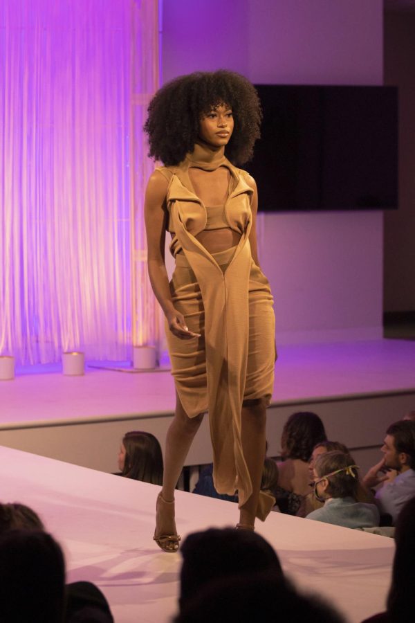 A Kent State student models D'Antae Butler collection during the annual fashion show on April 28, 2022.