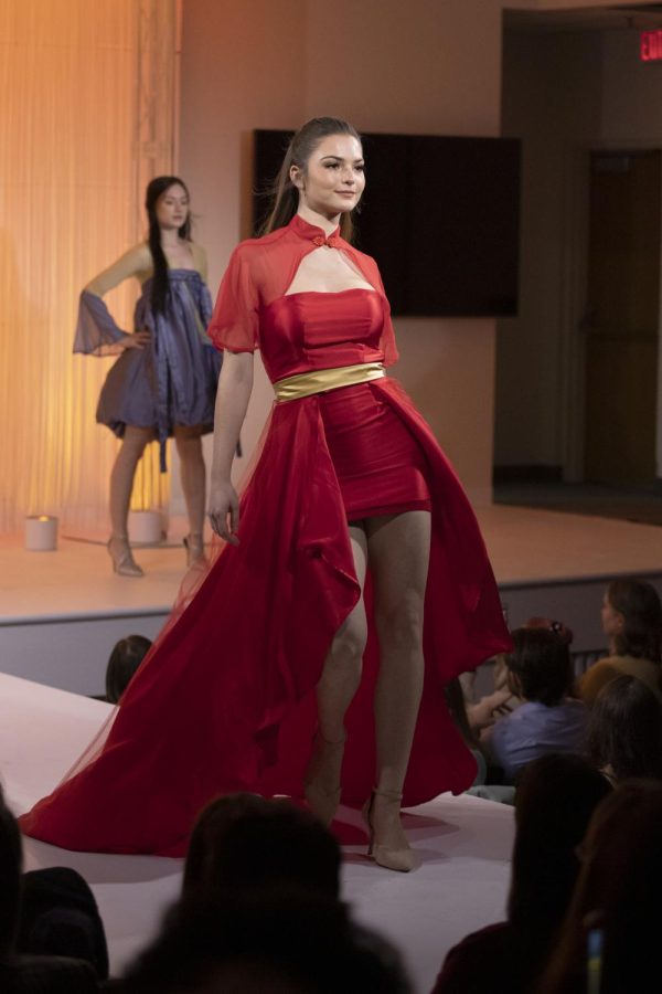 A Kent State student models Jiani Hu's collection during the annual fashion show on April 28, 2022.