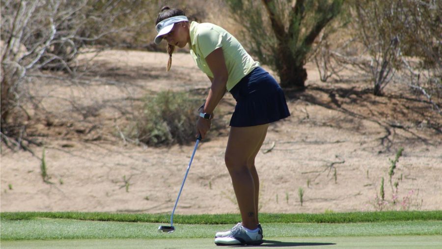 Fifth-year golfer Chloe Salort putts during a Kent State women's golf match.