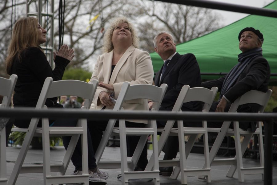 (From left to right) Roseann "Chic" Canfora, Provost Melody Tankersley, Jon Meacham and President Todd Diacon watch a video during the May 4 Commemoration on May 4, 2022. 