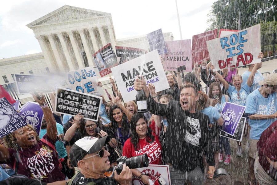 A celebration outside the Supreme Court, Friday, June 24, 2022, in Washington. The Supreme Court has ended constitutional protections for abortion that had been in place nearly 50 years — a decision by its conservative majority to overturn the court's landmark abortion cases. 