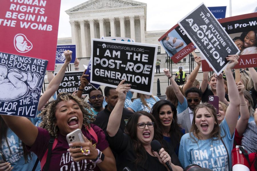 Demonstrators gather outside the Supreme Court in Washington, Friday, June 24, 2022. The Supreme Court has ended constitutional protections for abortion that had been in place nearly 50 years, a decision by its conservative majority to overturn the court's landmark abortion cases. 