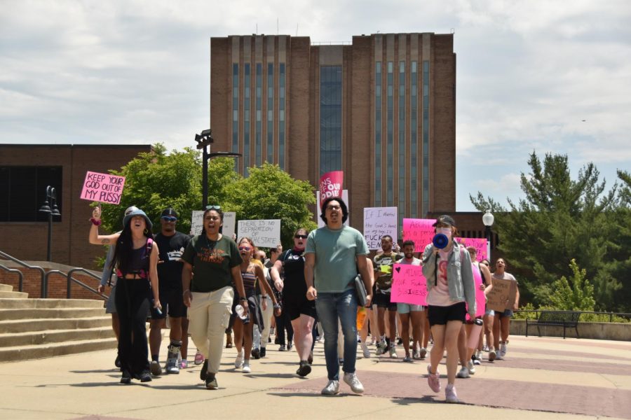 Protesters shout chants including "Abort the court!" and "This is what democracy looks like!" during the march to the courthouse.