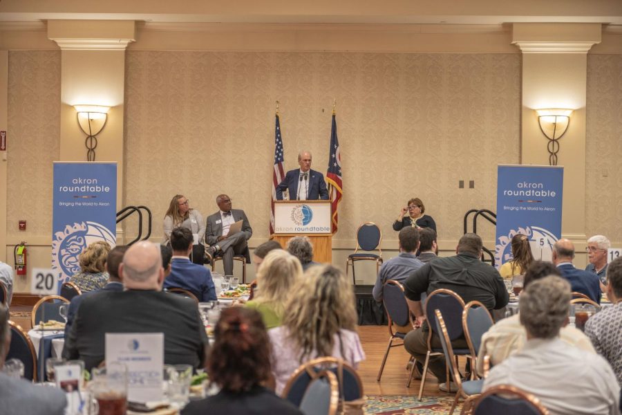 Kent State University President Todd Diacon speaking at Quaker State Catering Center for the Akron Roundtable luncheon on June 16, 2022. Diacon told listeners about the third wave economic change in education funding and access.