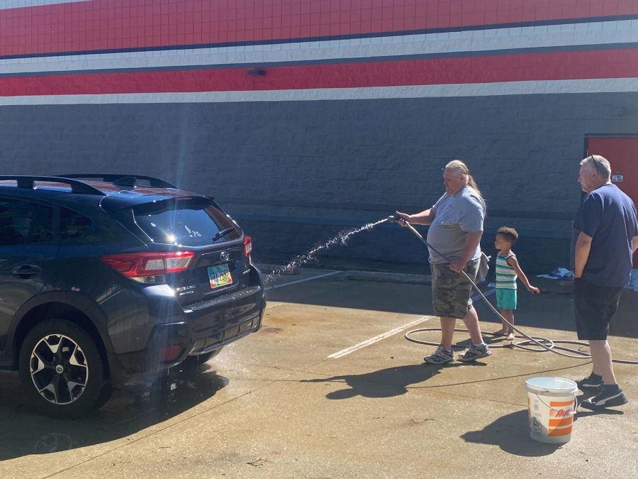 A car is washed during Saturday's breast cancer benefit car wash.