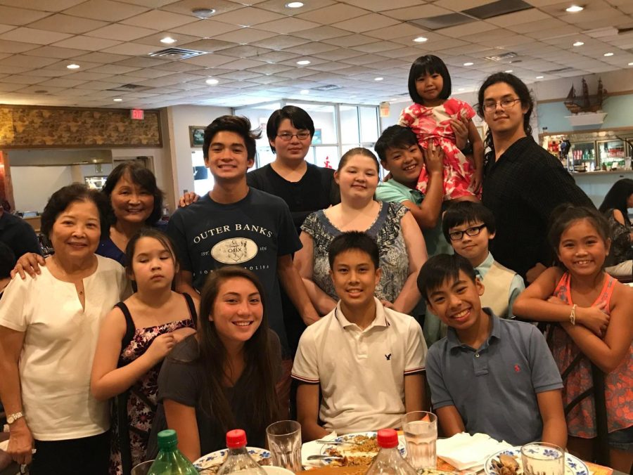 Colin Pho (pictured, top right) with his family.