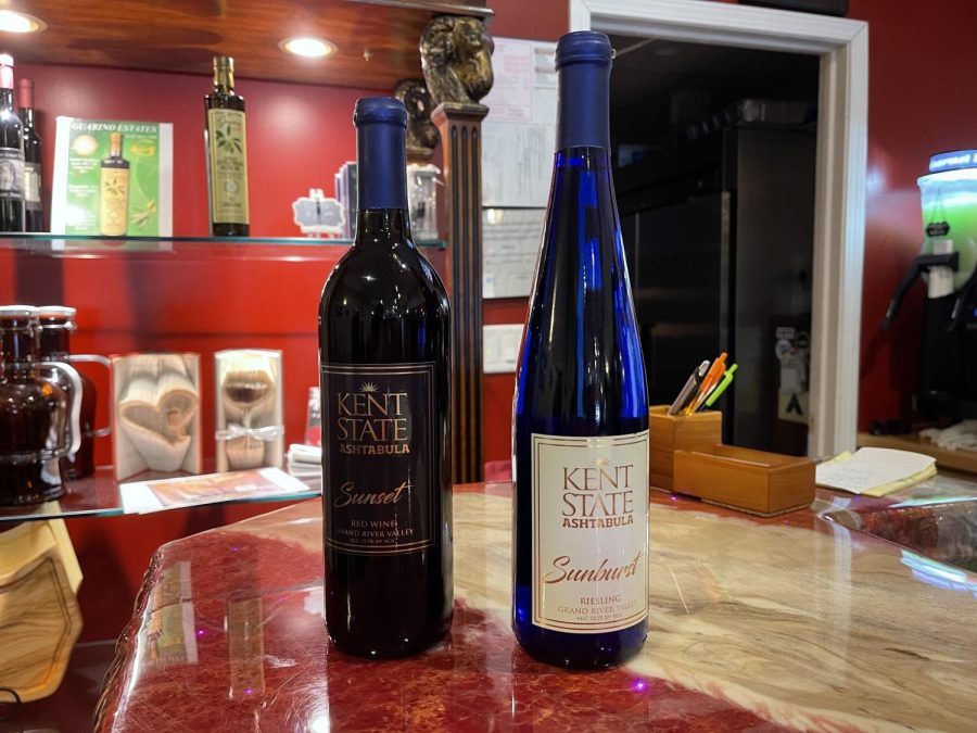 Wine made by Kent State students and bottled by Jim Wade. On the left is a red wine named "Sunset," and to the right is a riesling named "Sunburst."