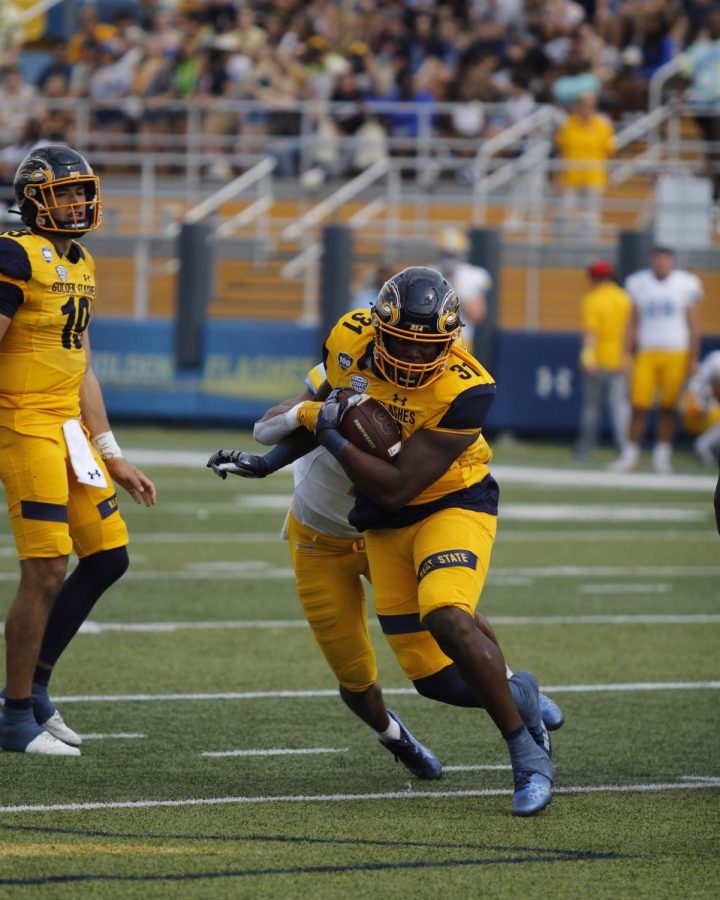 Running back Bryan Bradford breaks a tackle as he races down the field during the home game on Sept. 17, 2022.