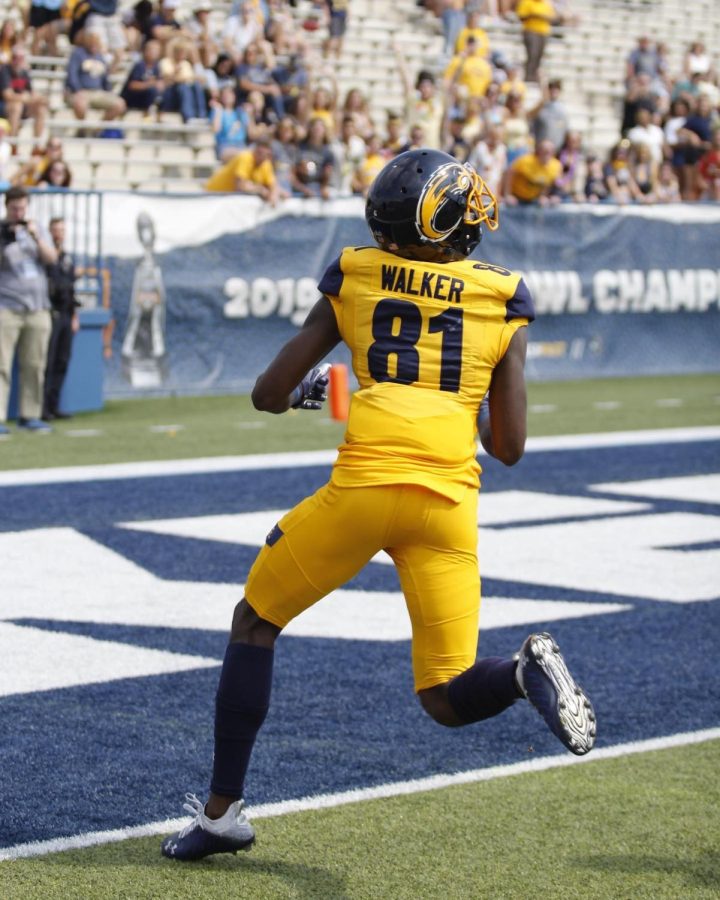 Kent State wide reciever Devontez Walker  looks for the ball as he runs into the endzone.