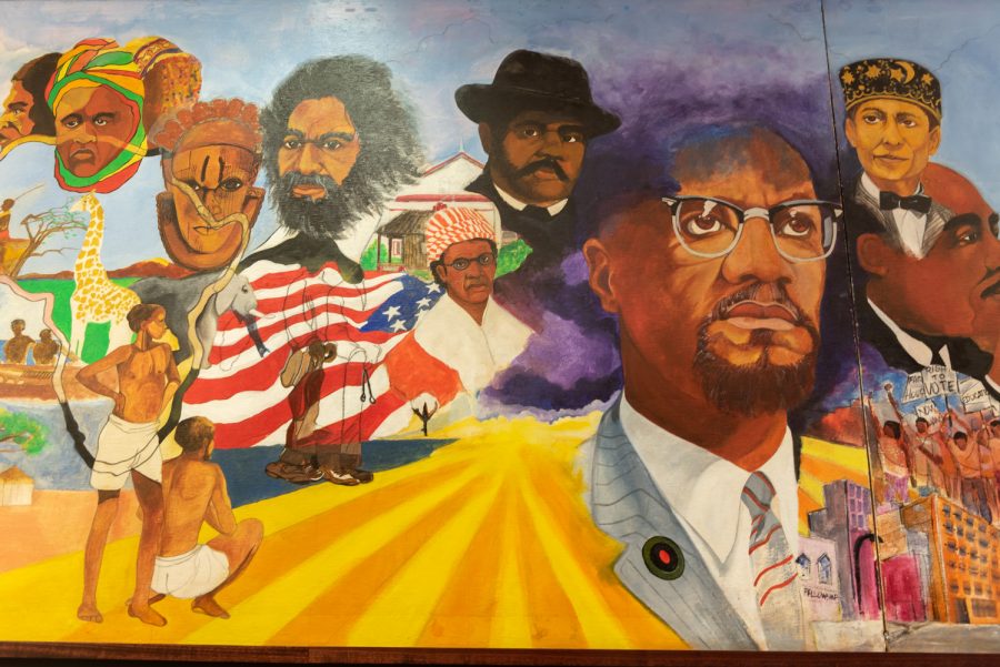 In the Malcom X lounge, there is a long mural dedicated to Malcolm X and many other prominent figures in the Black community. This art piece was one of the sights for the alumni group to view.