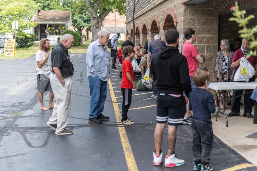 Guests of Faith Formation waiting to recieve food at Trinity Lutheran Church in Kent on September 10, 2022