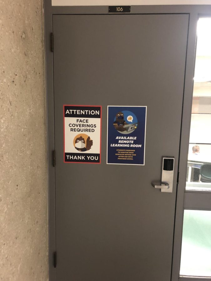 A room in the Business Administrative Building still has a "Face Covering Required" sign posted on the outside of the door even after the university ended their mask mandate.