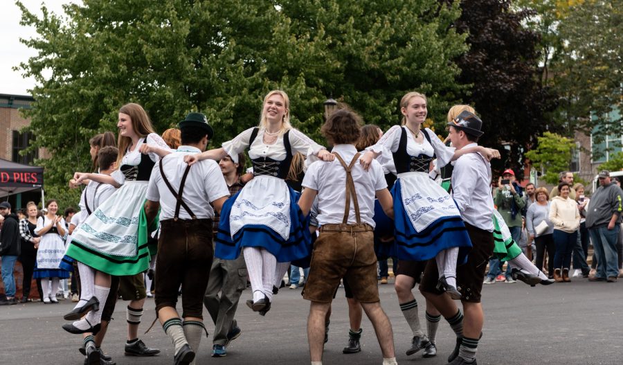 The German Family Society Dancers show the audience a trick during their performance. Many attendees watched and cheered on the group.