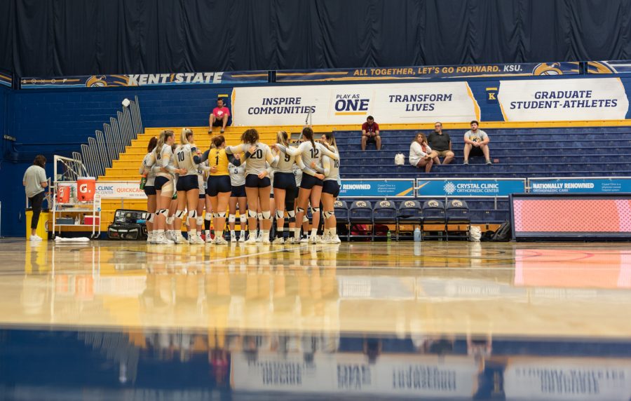 The Kent State Women's Volleyball team joins up for a huddle during a time-out. The Flashes played Cornell Sept. 3 but were beaten 3-1.