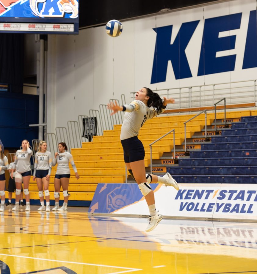 Kent State Women's Volleyball player Erin Gardner serves the ball onto the other side of the court. The team played a Saturday morning game against Cornell University.