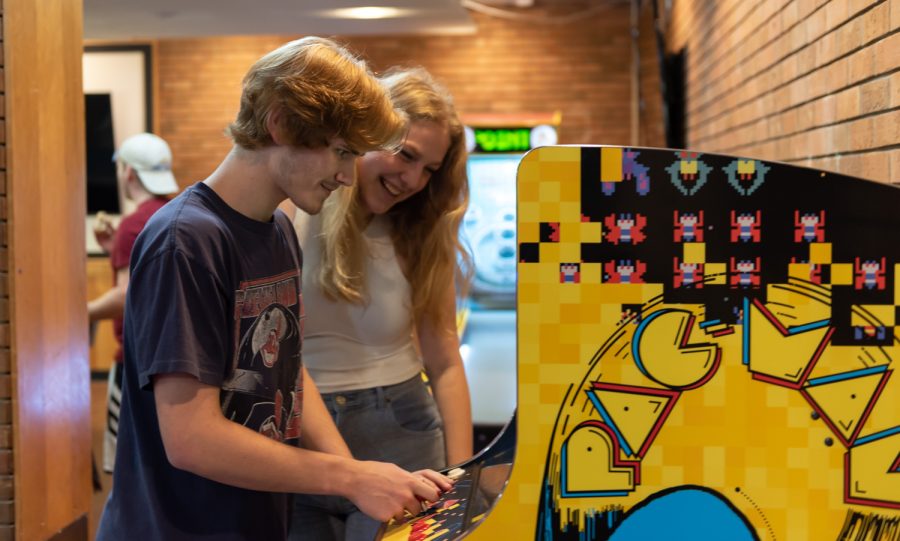 Joseph Hefler (left) and Jordan Zdych play Pac-Man on the arcade machine. "This is actually my first time coming to this area," Zdych said.