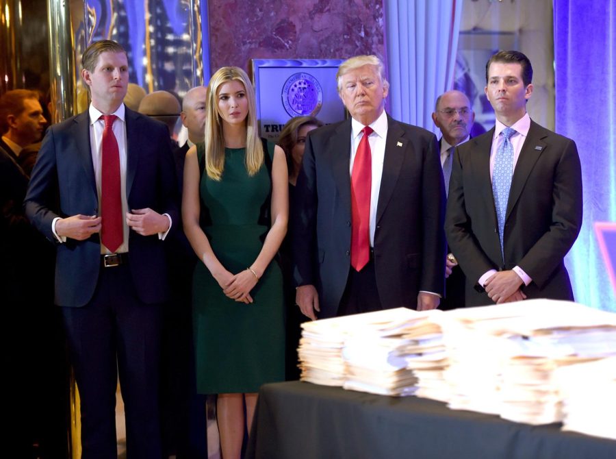 Then-President-elect Donald Trump along with his children Eric, left, Ivanka and Donald Jr. arrive for a press conference January 11, 2017 at Trump Tower in New York.