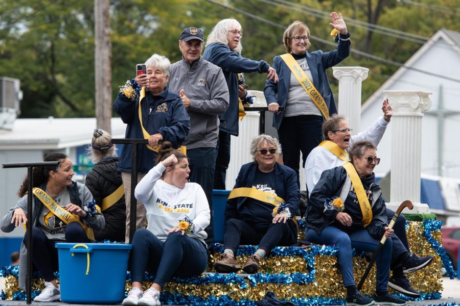 Kent State's 2022 Grand Marshals, former female student-athletes, ride with President Todd Diacon in the 2022 Homecoming Parade.